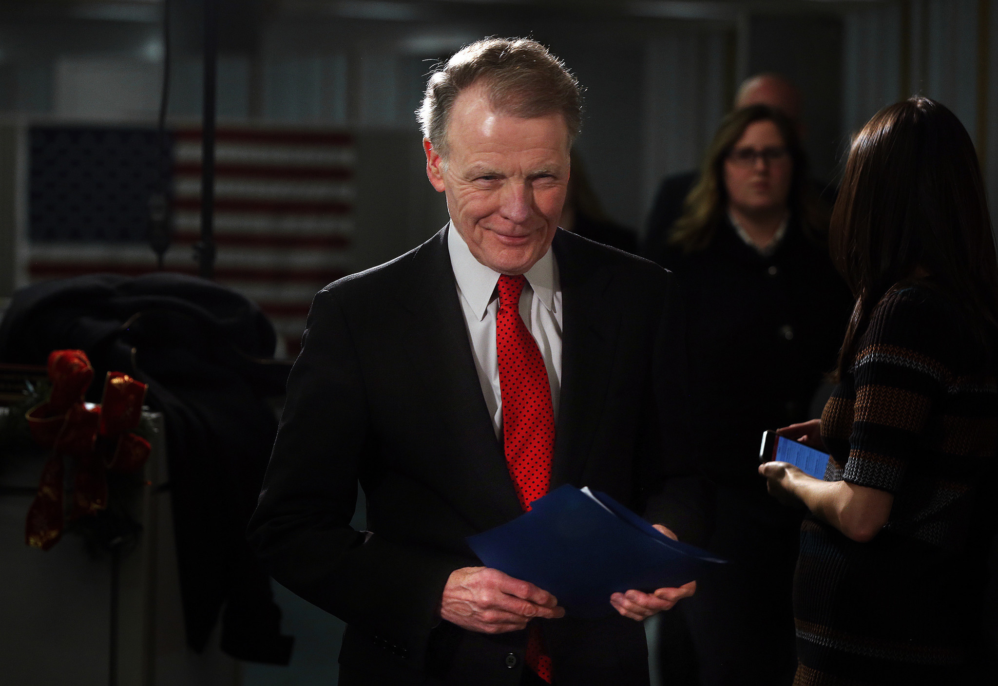 After a meeting with then-Gov. Bruce Rauner (not shown), Illinois...