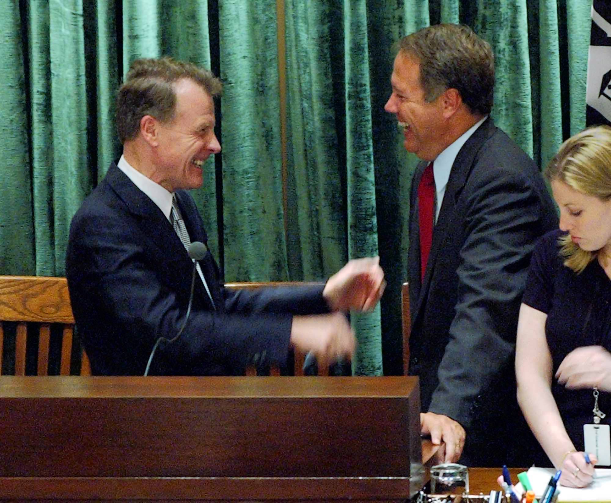 House Speaker Michael Madigan, left, celebrates with state Rep. Jay...