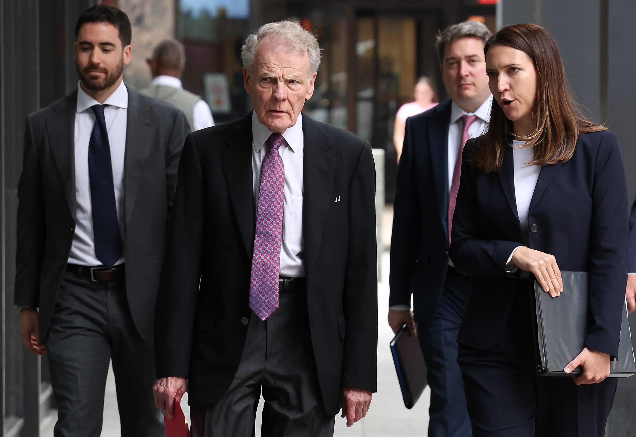 Former Illinois House Speaker Michael Madigan, second from left, arrives...