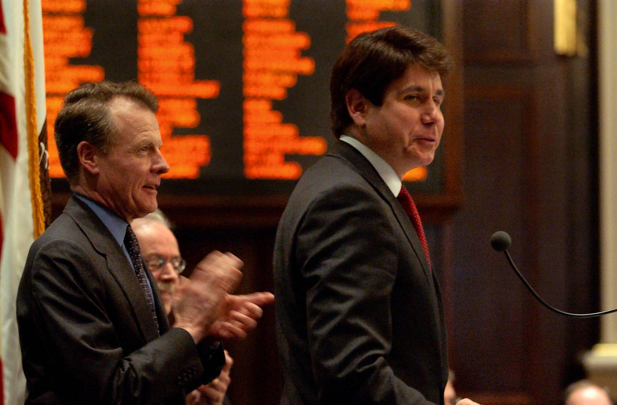 House Speaker Michael Madigan, left, introduces newly elected Gov. Rod...