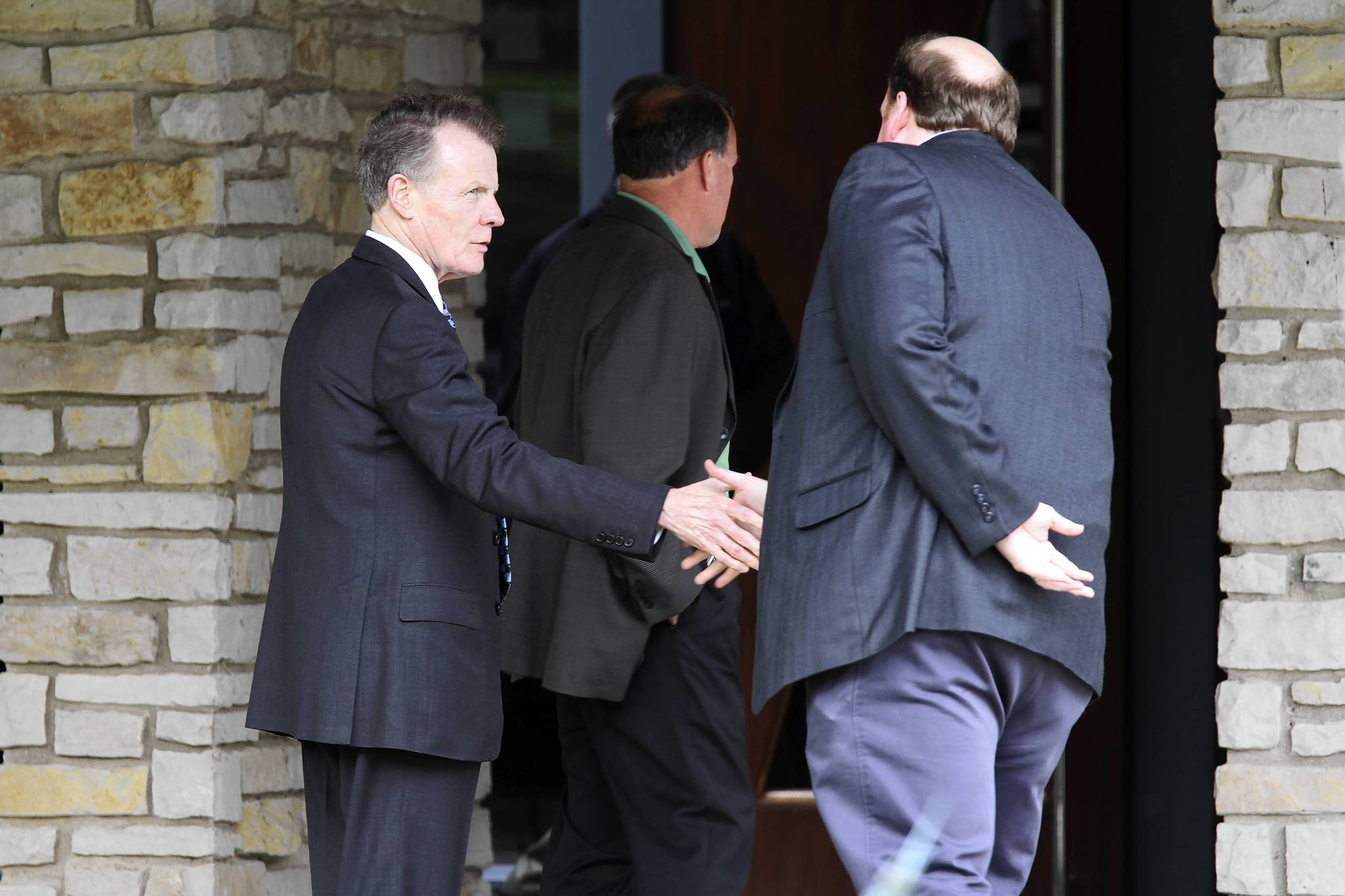 House Speaker Michael Madigan, D-Chicago, left, greets supporters as they...