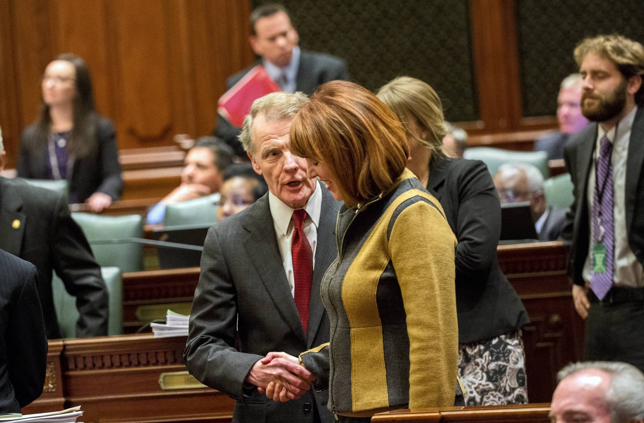 House Speaker Michael Madigan talks to Rep. Carol Sente on...