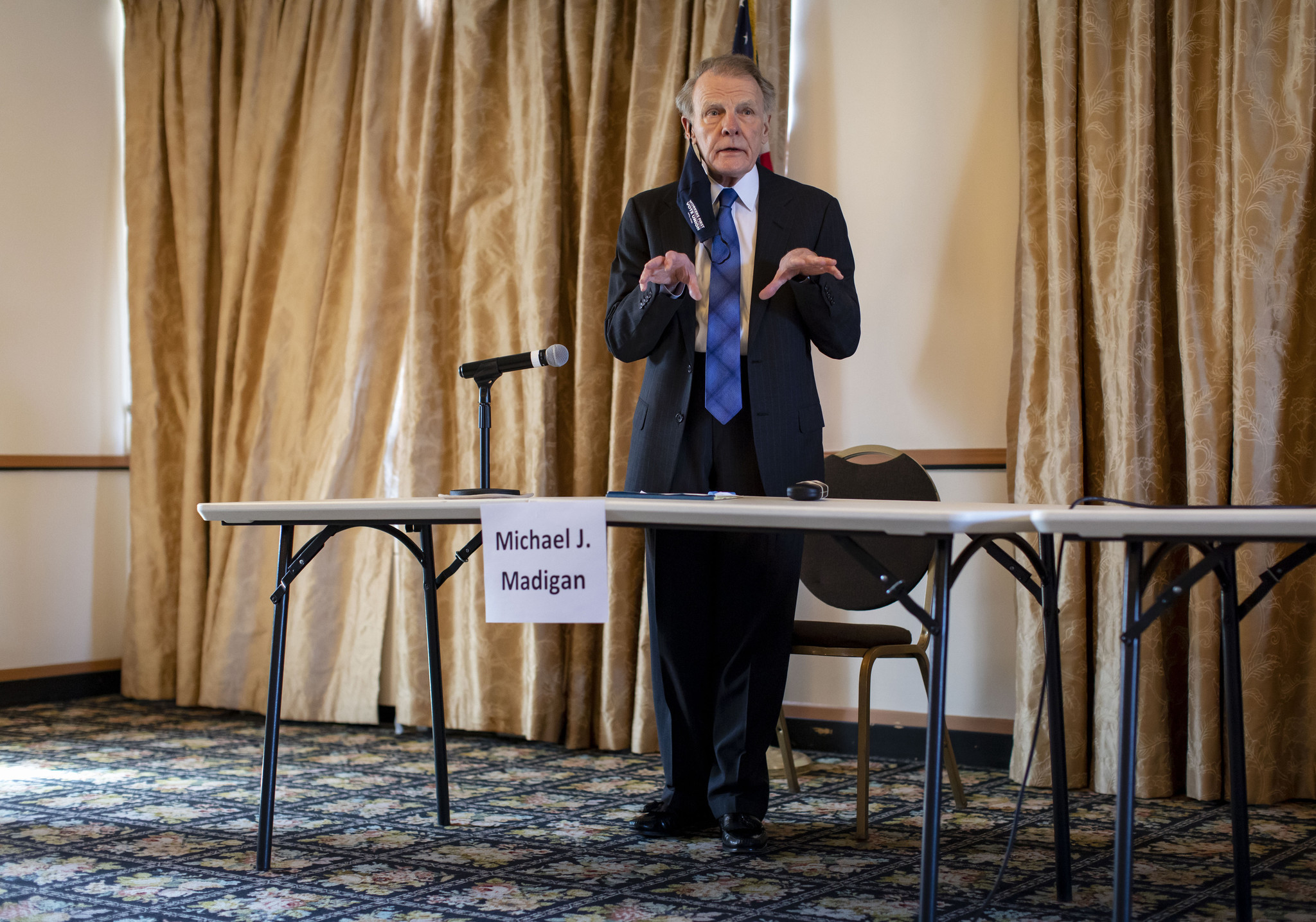 Former Illinois House Speaker Michael Madigan talks during a meeting...