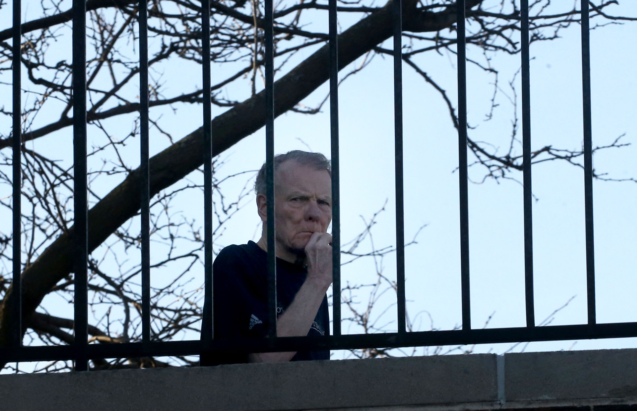 Former Illinois House Speaker Michael Madigan walks on his second-floor...