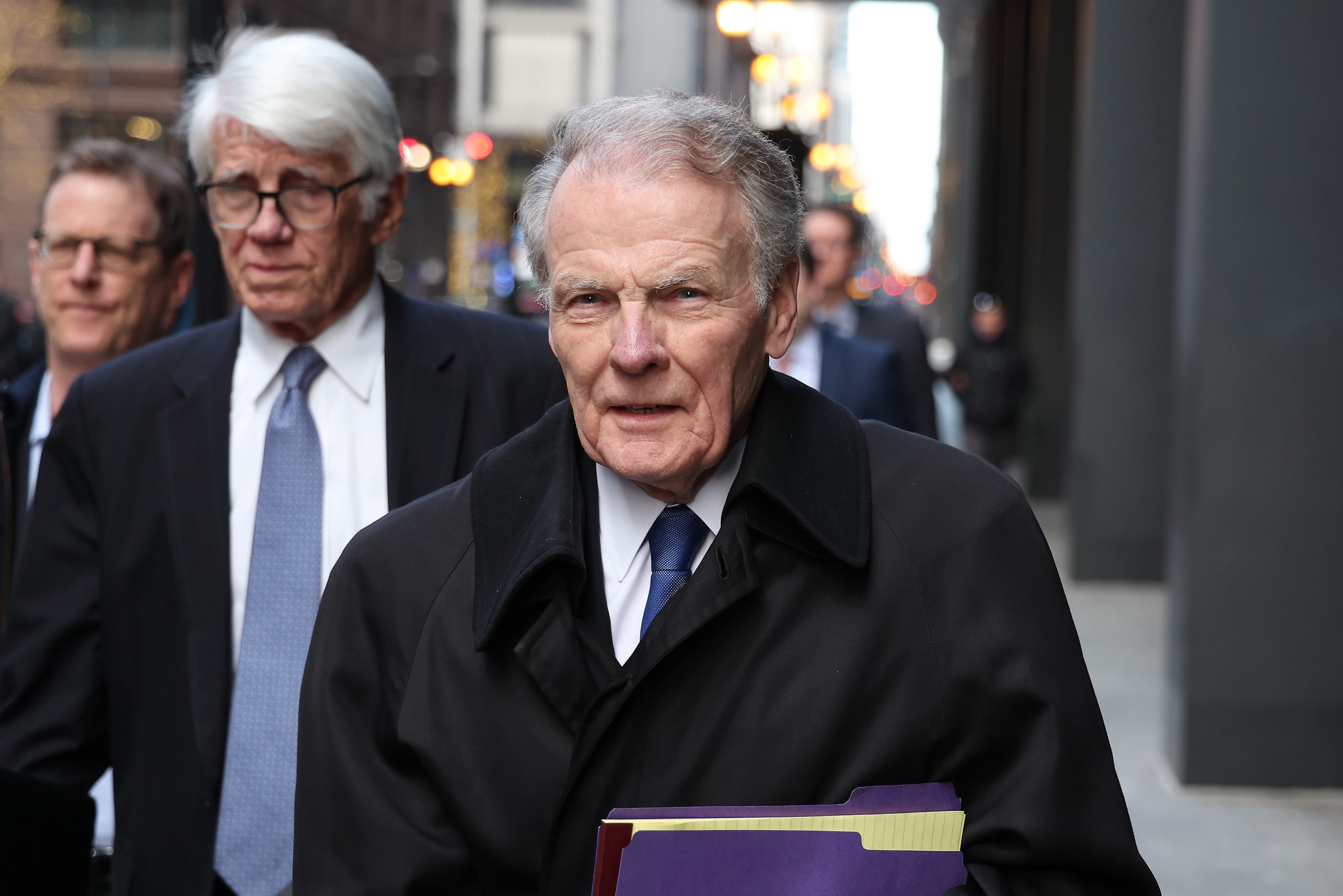 Former Illinois House Speaker Michael Madigan, foreground, leaves the Dirksen...